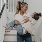 Shannon Willardson holding child while walking down the stairs all that nutrition story
