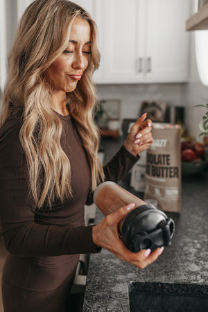 Shannon making a chocolate protein shake